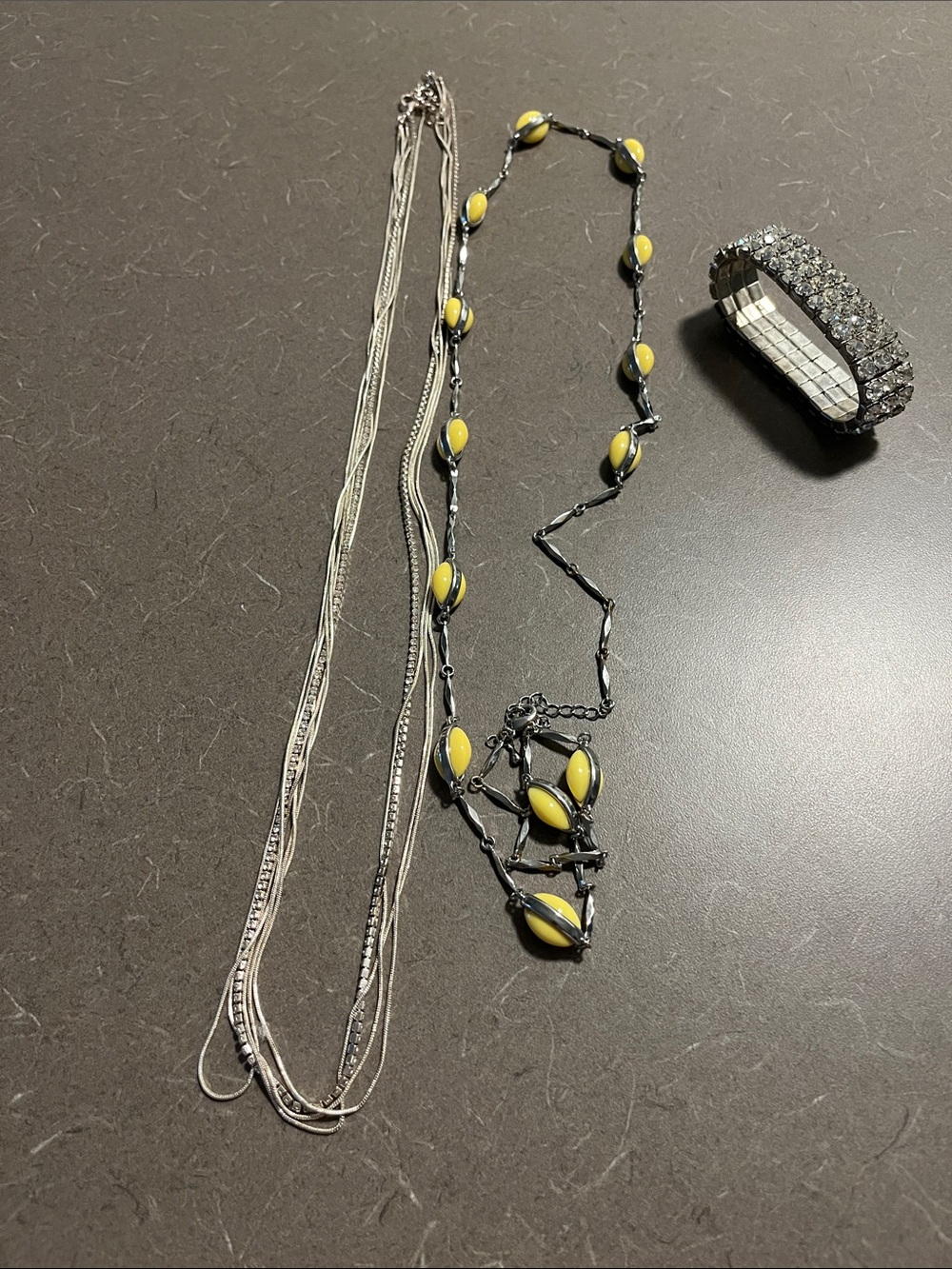 Misc necklaces and rhinestone bracelet.